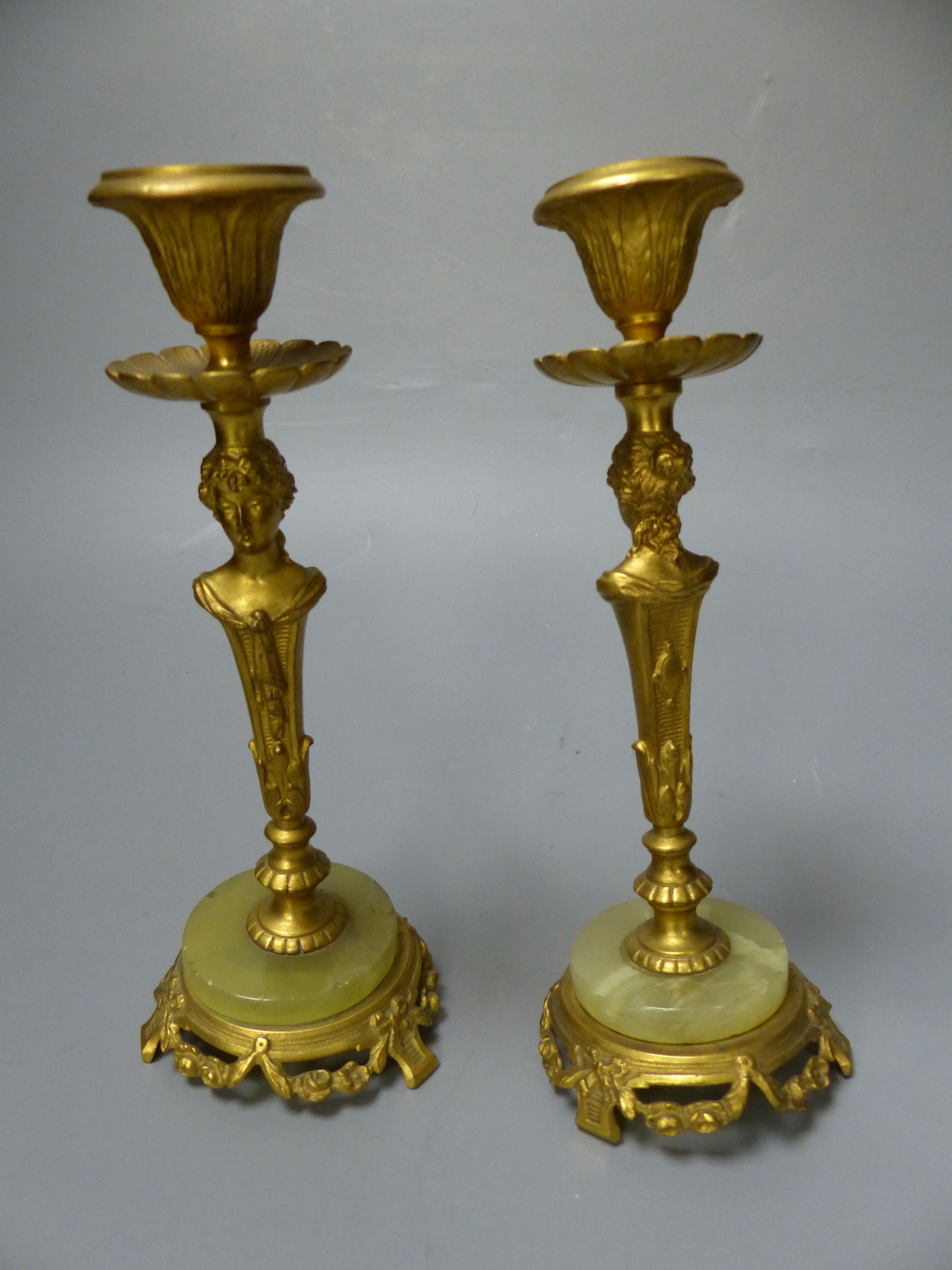 A pair of 19th century gilt metal and onyx figural candlesticks, height 17cm (a.f.)